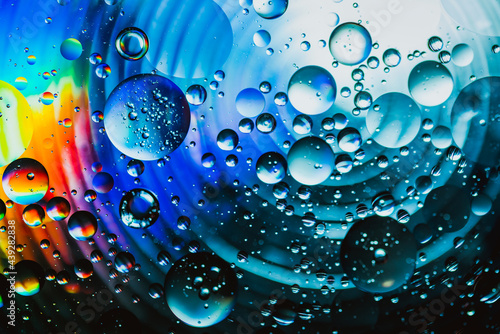 Colorful oil drops in water abstract background