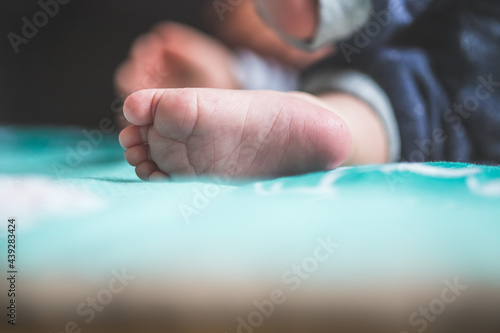 Baby and newborn concept: Close up of newborn baby feet on baby blanket
