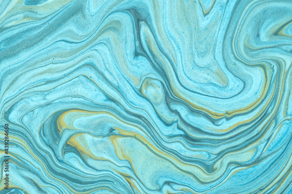 Abstract fluid art background light blue and beige colors. Liquid marble. Acrylic painting with turquoise gradient.