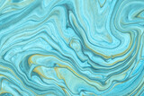 Abstract fluid art background light blue and beige colors. Liquid marble. Acrylic painting with turquoise gradient.