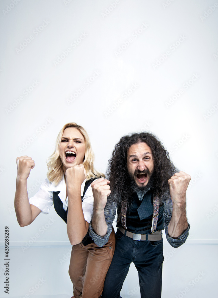 Funny hipster couple posing on white background Funny hipster couple posing on white background