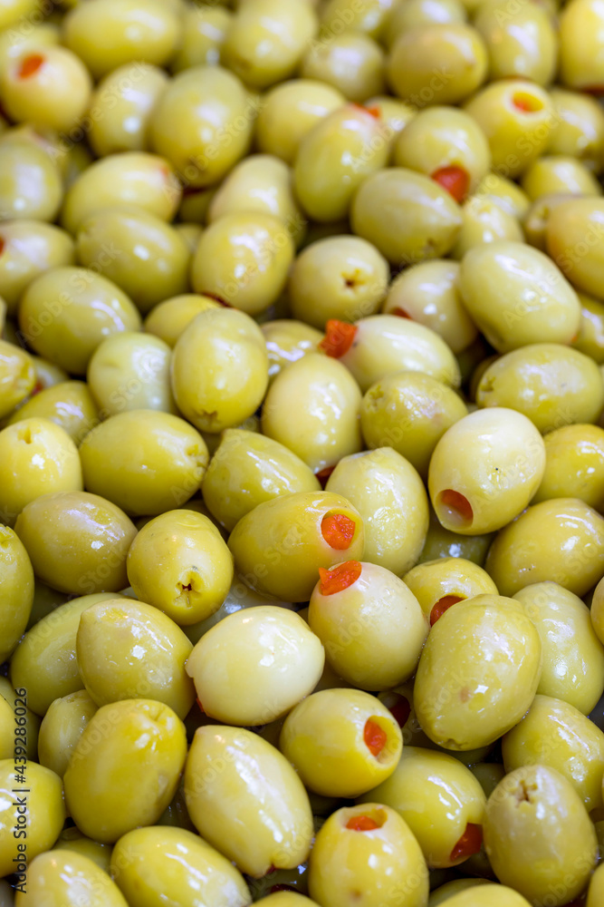 Pepper Stuffed Green Olives. Close up. Green olives as background texture Pepper Stuffed Green Olives. Close up. Green olives as background texture