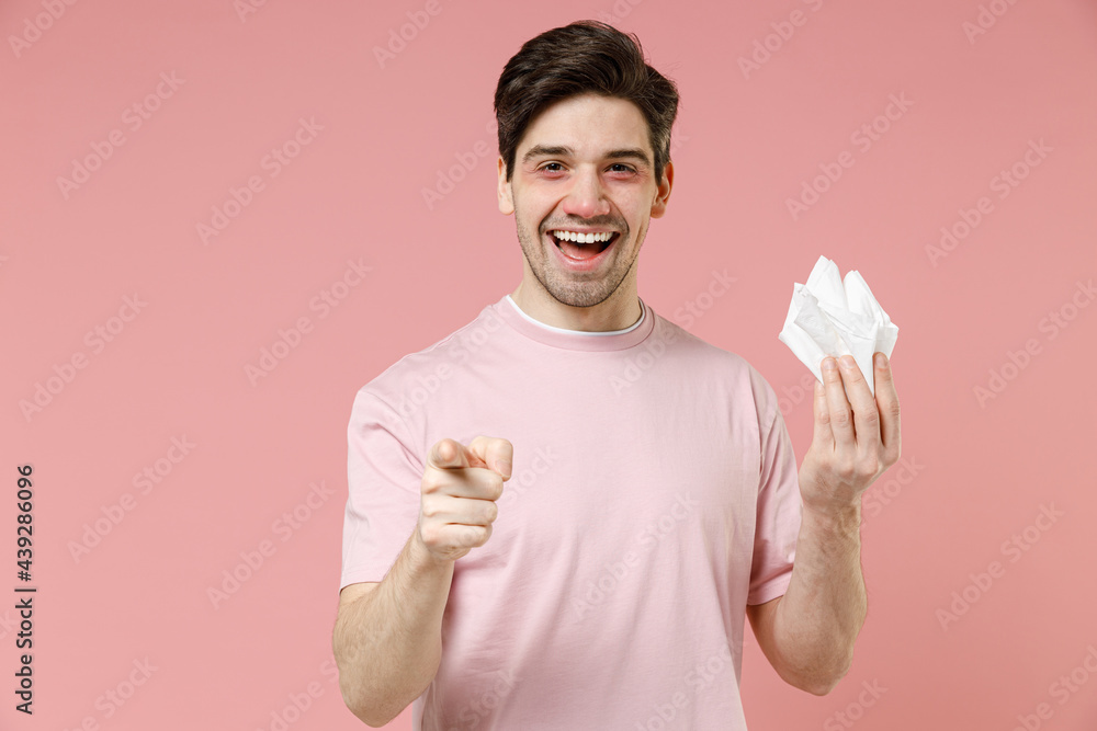 Sick ill allergic happy smiling adult man wear rozy tshirt has red