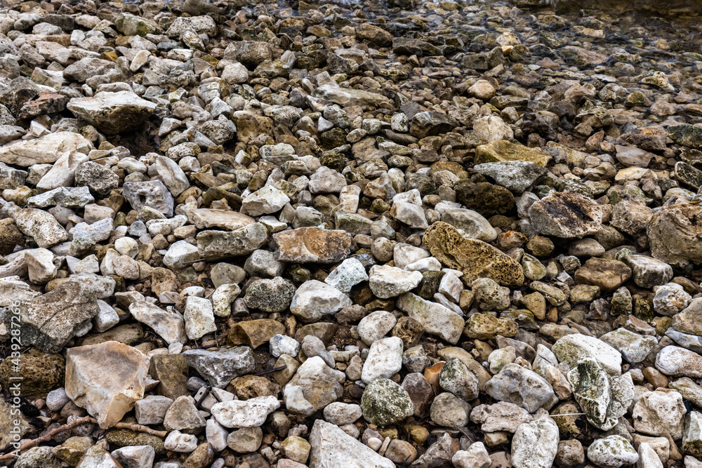 The texture of stones with jagged edges. Lots of small stones.