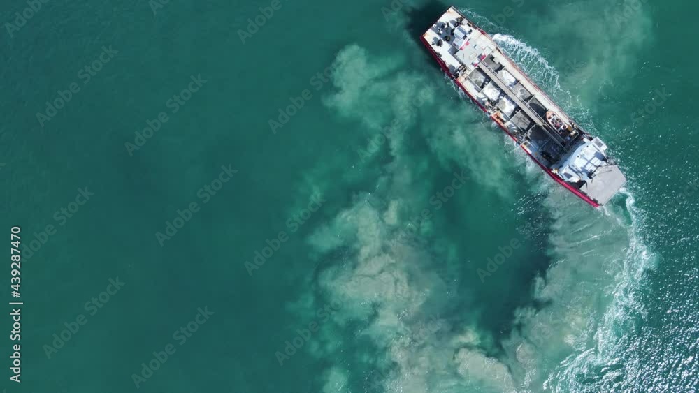 Unique high view of the environmental impact to a sensitive marine precinct cause by a large industrial ship maneuvering. Unique high view of the environmental impact to a sensitive marine precinct cause by a large industrial ship maneuvering.