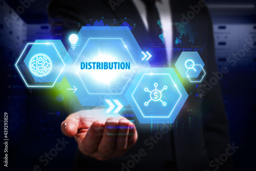Business, Technology, Internet and network concept. Young businessman working on a virtual screen of the future and sees the inscription: Distribution