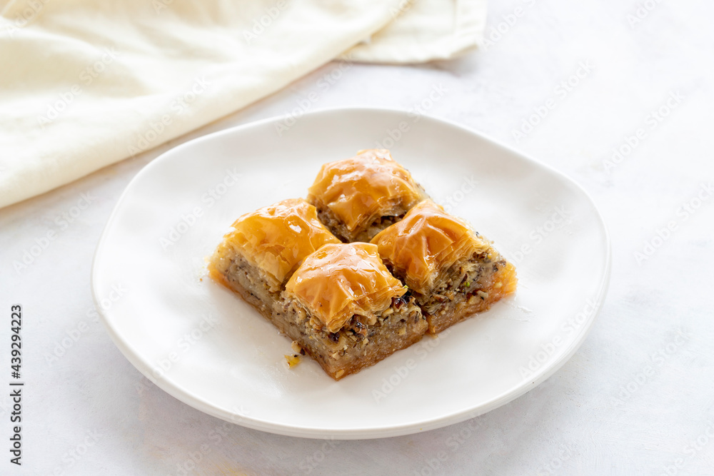Baklava with Walnut. Turkish baklava on a white background. Local name cevizli baklava