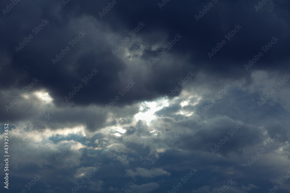 Dark clouds before rain . Dramatic stormy sky light beam . Meteorology background Dark clouds before rain . Dramatic stormy sky light beam . Meteorology background