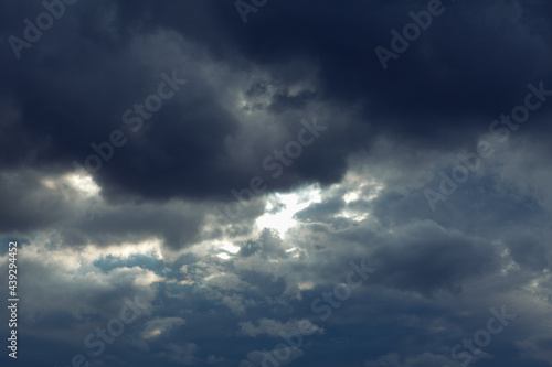 Dark clouds before rain . Dramatic stormy sky light beam . Meteorology background