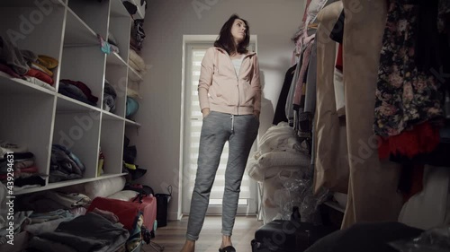 Sad woman doesn't know what to wear