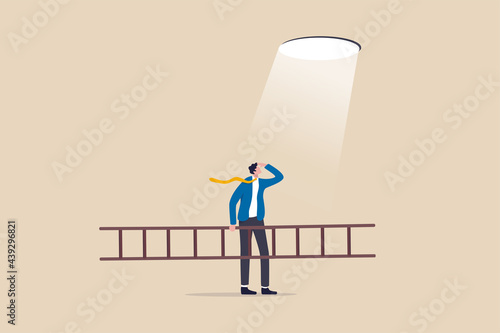 Business hope to solve crisis problem, plan and strategy to reach achievement, ladder of success concept, businessman holding ladder looking at hope light planning to climb and escape through hole.