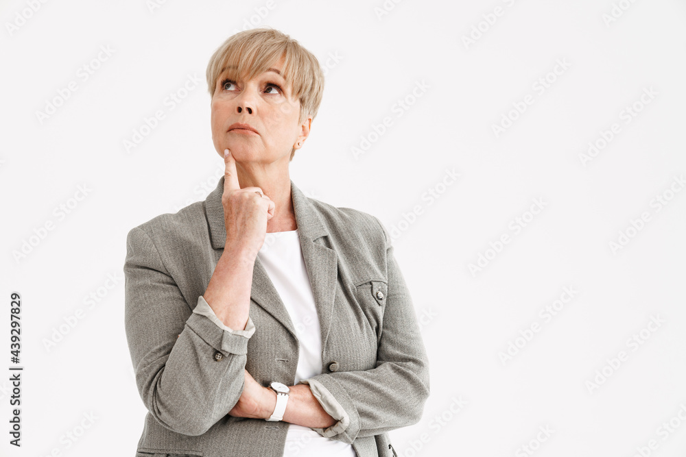 European mature woman in jacket posing and looking upward European mature woman in jacket posing and looking upward
