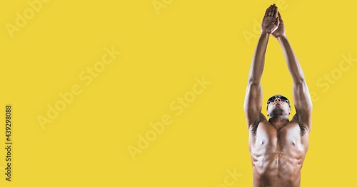 Composition of male swimmer with copy space isolated on yellow background