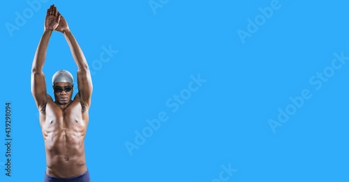 Composition of male swimmer with copy space isolated on blue background