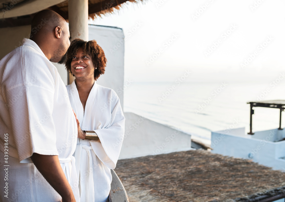 African American couple in bathrobes at hotel African American couple in bathrobes at hotel