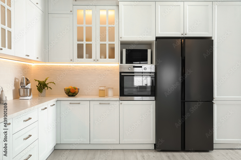 Modern kitchen interior with stylish white furniture Modern kitchen interior with stylish white furniture