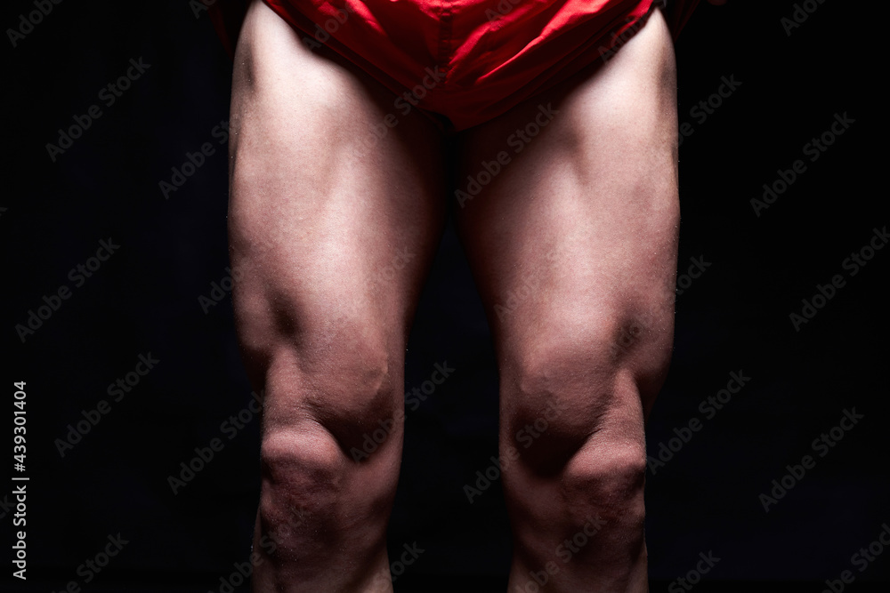 Naklejka premium male muscular legs. body-building. muscle man