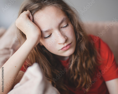 Portrait of a sad teenage girl looking thoughtful