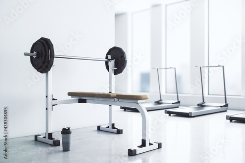 Modern gym interior with equipment, city view and daylight. 3D Rendering.