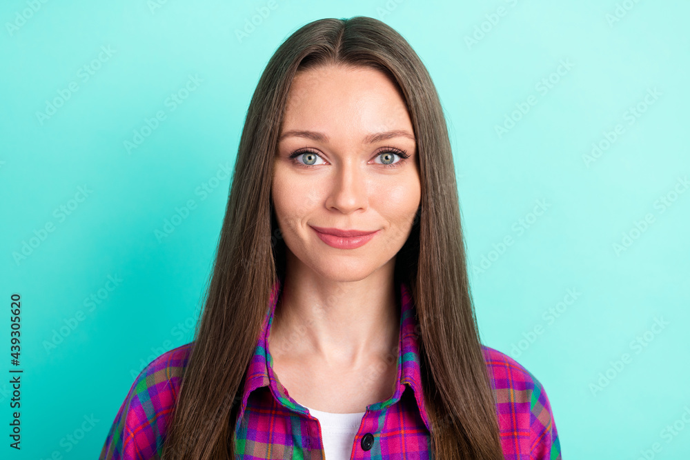 Photo of joyful long hairdo young lady wear violet shirt isolated on vivid teal color background Photo of joyful long hairdo young lady wear violet shirt isolated on vivid teal color background