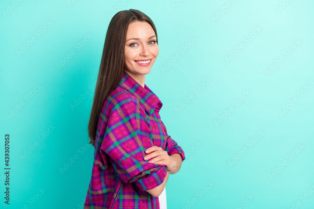 Profile side view portrait of pretty cheerful content girl folded arms copy space isolated over bright teal color background Profile side view portrait of pretty cheerful content girl folded arms copy space isolated over bright teal color background