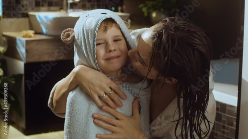 Happy mom and her son after bath