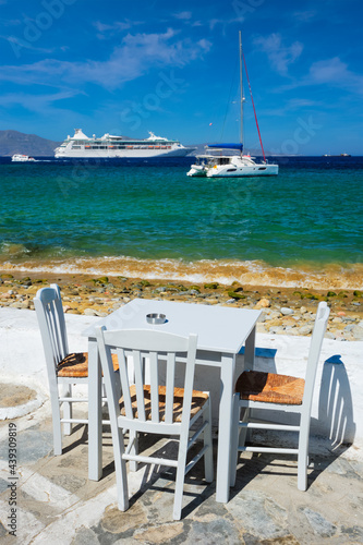 Catamaran yacht and cruise liner is Aegean sea. Chora, Mykonos island, Greece © Dmitry Rukhlenko