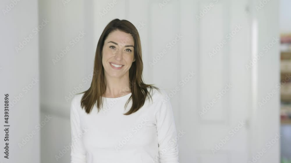 Attractive woman looking at camera, smiling Attractive woman looking at camera, smiling