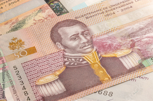 Close up to 25 Gourde or Gourdes of the Republic of Haiti. Paper banknotes of the Caribbean country. Detailed capture of the front art design. Detailed money background wallpaper. Currency bank note