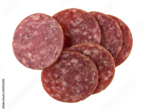 Group of dry salami slices on a white background.