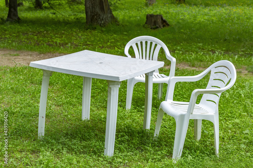 Vacant table and chairs of an outdoor street cafe without people as a symbol of the economic crisis