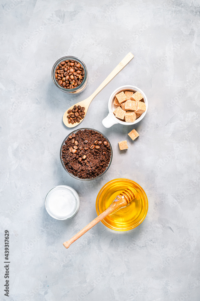 Fototapeta premium Homemade body scrub of ground coffee, sugar and coconut oil, homemade cosmetic for peeling top view