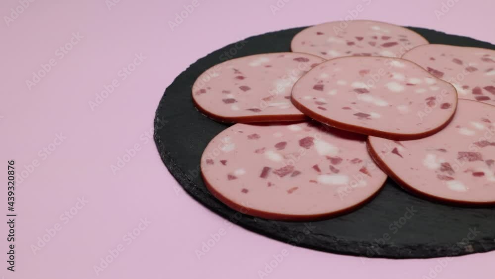 Thinly Sliced Veal Sausage On A Slate Plate. Panning Slider Shot. Thinly Sliced Veal Sausage On A Slate Plate. Panning Slider Shot.