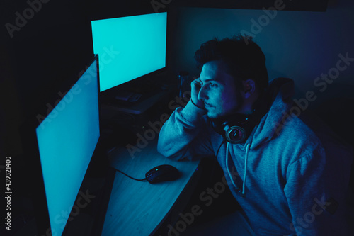 Wallpaper Mural Young streamer working at night from home Torontodigital.ca