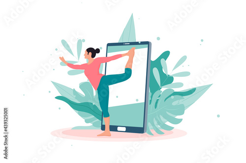 Yoga online with girl in asana doing physical exercises and watching online classes on Phone display