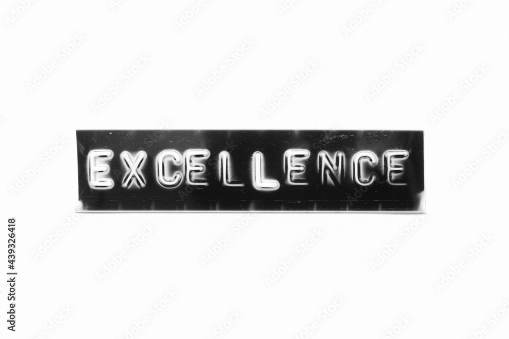 Embossed letter with word excellence in black banner on white paper background Embossed letter with word excellence in black banner on white paper background