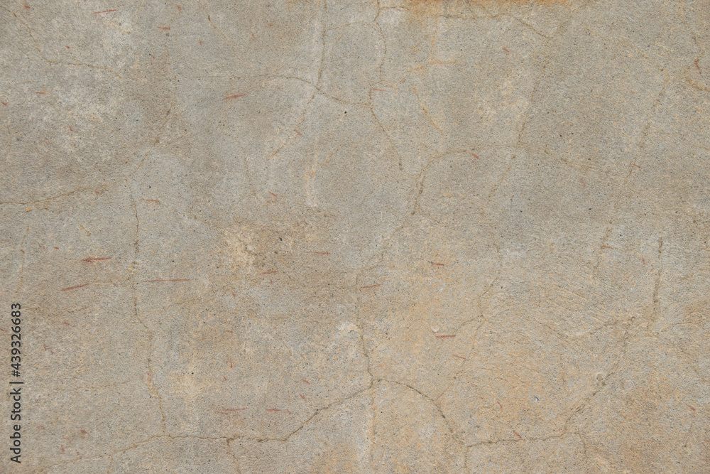 Gray concrete wall with cracks. Gray color background with copy space