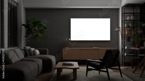 Glowing TV screen mock up at night in the living room with concrete wall.