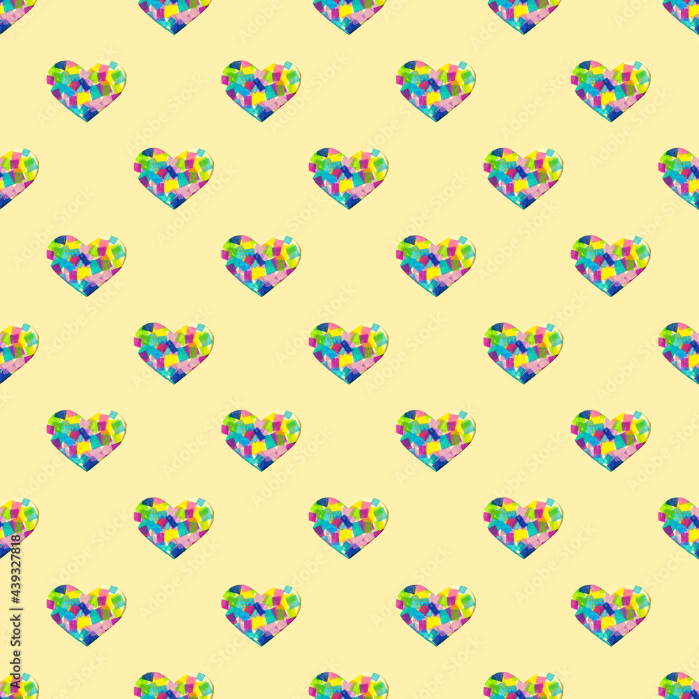 creative pattern with paper cut heart and multicolored patchwork. yellow pastel background for copy space