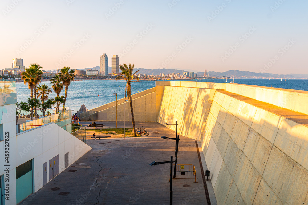 Obraz premium Picture of Barceloneta beach and barcelona towers, captured in a sunny day. Mediterranean sea.
