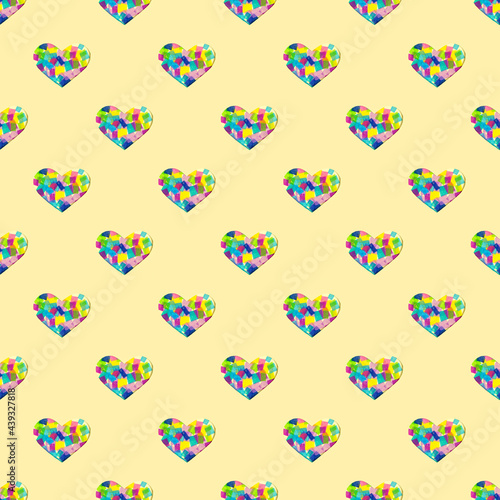 creative pattern with paper cut heart and multicolored patchwork. yellow pastel background for copy space
