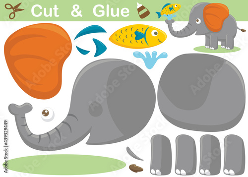 Funny elephant cartoon with a fish. Education paper game for children. Cutout and gluing