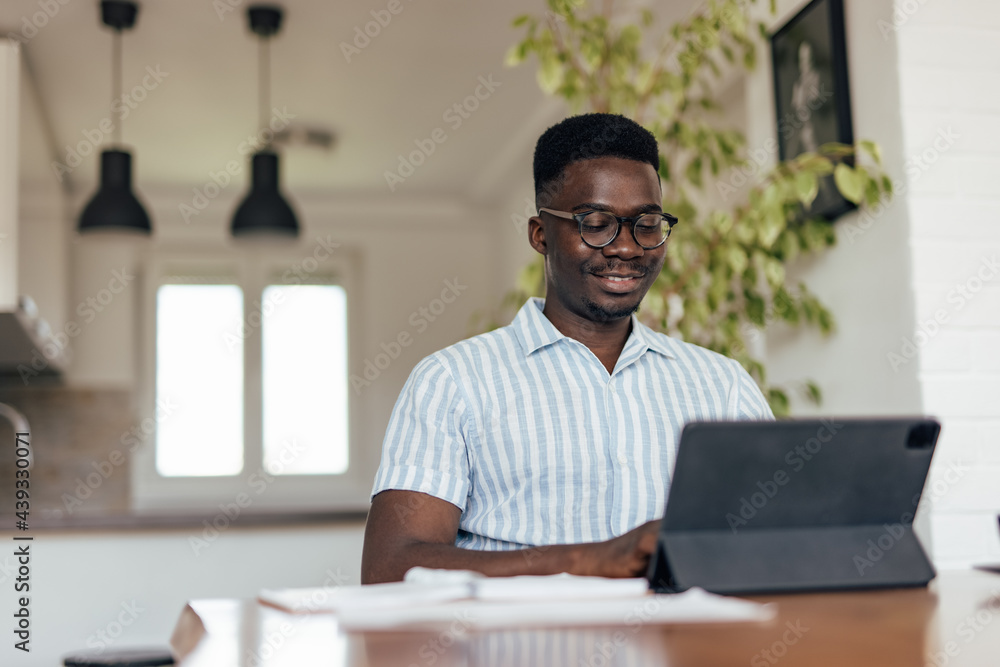 Fototapeta premium Adult man, consulting with his boss, over the video call.