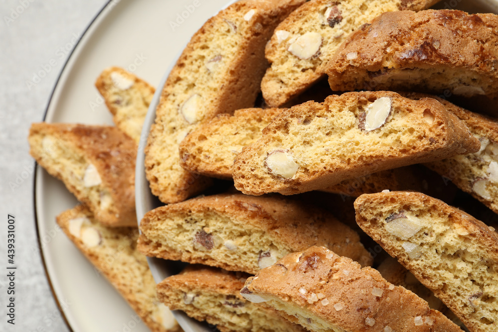 Traditional Italian almond biscuits (Cantucci) on plate, closeup