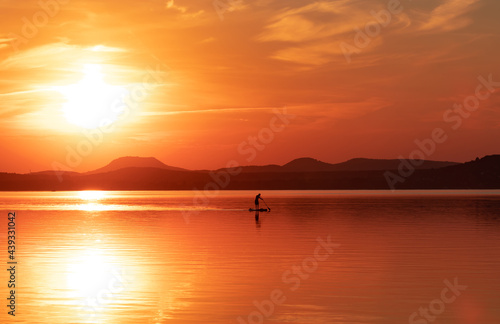 Landscape with a beautiful sunrise on the lake