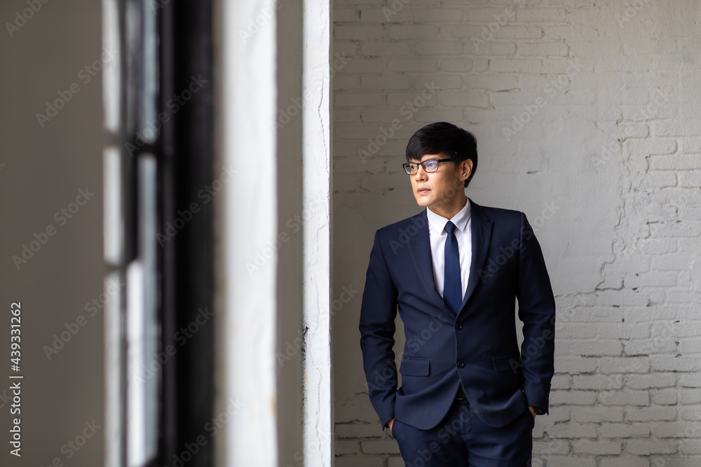 Portrait of successful business people woking in office. Handsome asian business man standing at home office. Portrait of successful business people woking in office. Handsome asian business man standing at home office.