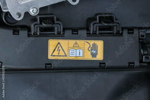 Warning label in a new vehicle engine bay