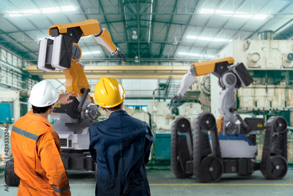 Engineer working with robot arm machine industrial 4.0 technology in factory. Futuristic innovation digital technology production line management. Engineer working with robot arm machine industrial 4.0 technology in factory. Futuristic innovation digital technology production line management.