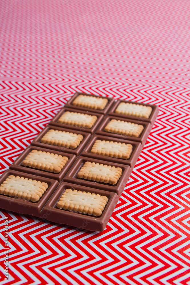 Vertical shot of delicious chocolate bar with crunchy cookies angle view. Vertical shot of delicious chocolate bar with crunchy cookies angle view.