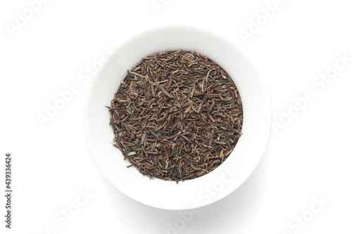 Macro close-up of Organic Black Cumin (Elwendia persica) or black caraway or Kala jeera on white background. Pile of Indian Aromatic Spice. Top view